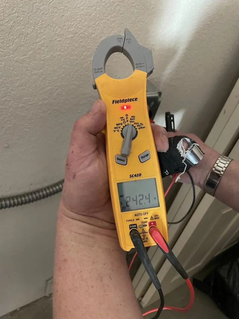 Voltage testing with clamp meter during Whole House Surge Protector in Ahtanum